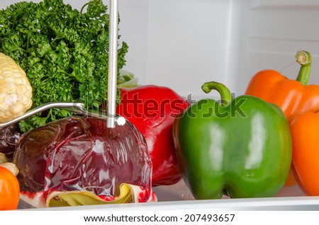 Part of a refrigerator with different vegetables