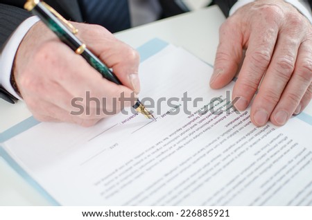 Signature of a contract, closeup