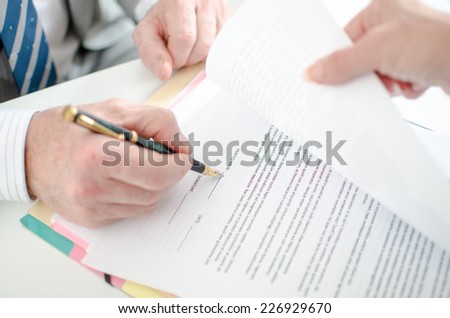 Signature of a contract, closeup
