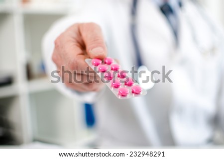 Doctor holding a blister with pills
