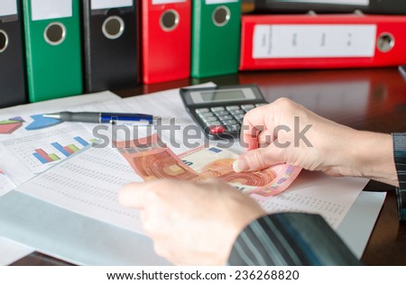 Female accountant counts money