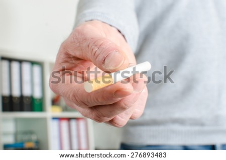 Man hand offering a cigarette, closeup