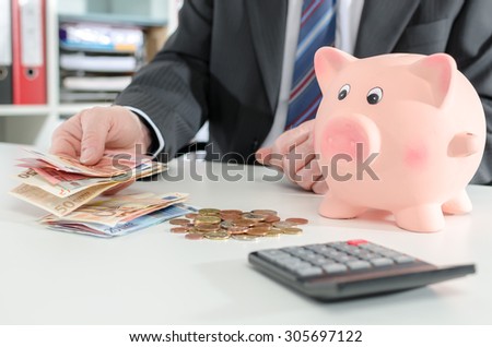 Banker counting money at the agency