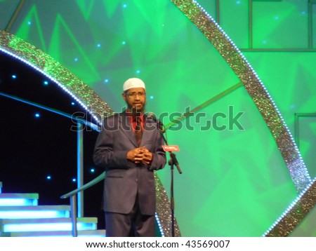 DUBAI, UAE - AUGUST 28: Dr Zakir Naik famous Muslim preacher and orator delivers speech to crowd at Airport Expo Centre August 28, 2009 in Dubai, UAE.