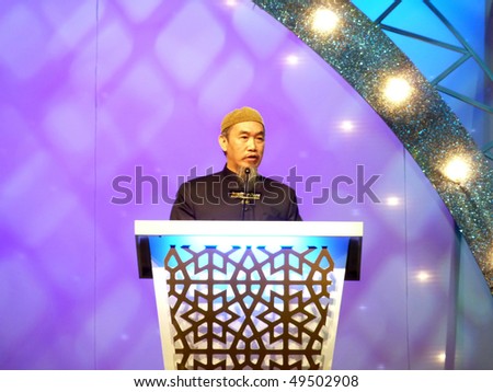 DUBAI - MARCH 19: Islamic orator Hussain Yee delivers speech during Dubai International Peace Convention at Airport Expo Dubai March 19, 2010 in Dubai.