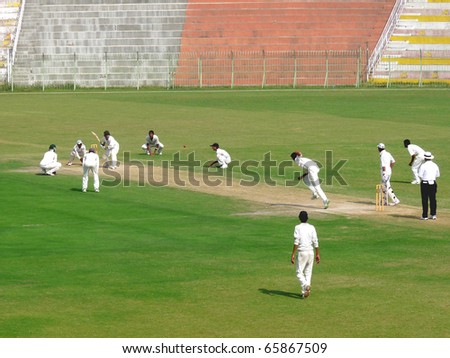 SIALKOT, PAKISTAN - OCTOBER 16: Under 19 cricket match Played between Hafizabad and Mandi Bahaudin teams at Jinnah Cricket Stadium. October 16, 2010 in Sialkot, Pakistan