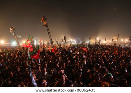 LAHORE, PAKISTAN - OCT 30: Hundreds of thousands people gather at Minar-e-Pakistan during a political rally of cricketer turned politician Imran Khan on October 30, 2011 in Lahore, Pakistan