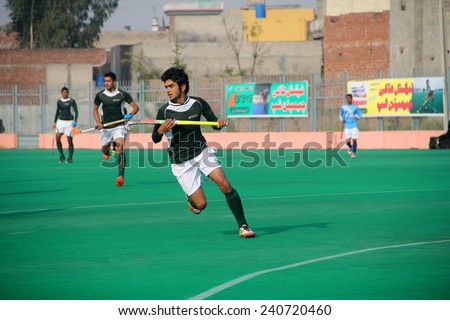 SIALKOT, PAKISTAN - DECEMBER 2014: All Pakistan Annual Field Hockey Tournament Between PIA and PAF Teams at Sialkot International Hockey Stadium on December 30, 2014