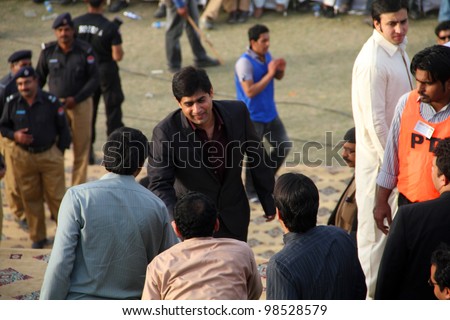 SIALKOT, PAKISTAN - MAR 23: Famous singer Abrar-ul-Haq arriving at Jinnah Cricket Stadium during a political rally of cricketer turned politician Imran Khan on March 23, 2012 in Sialkot, Pakistan