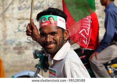 SIALKOT, PAKISTAN - MAR 23: PTI Supporter at Jinnah Cricket Stadium during a political rally of cricketer turned politician Imran Khan on March 23, 2012 in Sialkot, Pakistan