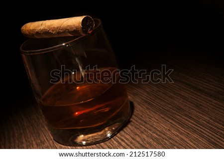 Luxury whiskey glass with cigar