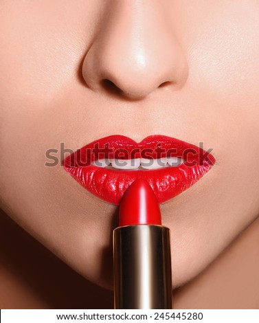 Sensual open mouth  with red tube of lipstick Macro shot of evening make up lips