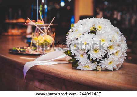 beautiful white wedding bouquet with white ribbon
