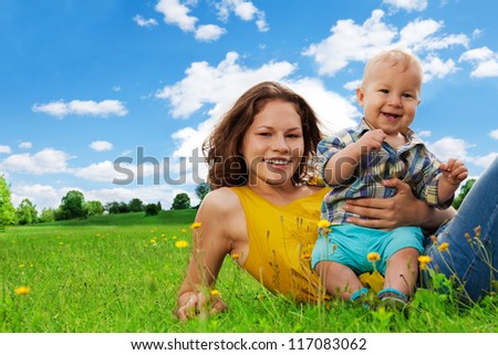 nice woman with baby having a nice day in the park