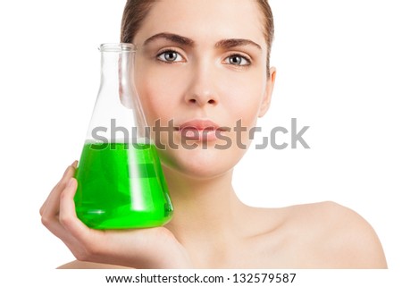Makeup laboratory beauty scientist portrait - woman holding flask glass with green chemicals
