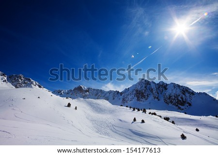 Mountain landscape in Pyrenees mountains with paths from freestyle skiers