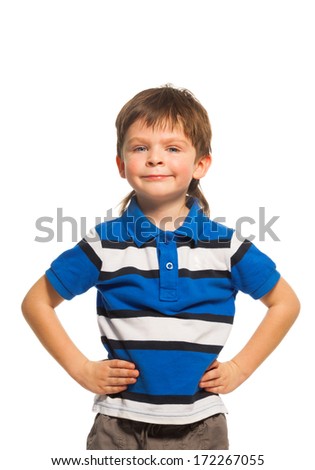 Waist up portrait of a 3 years old boy in blue shirt standing isolated on white