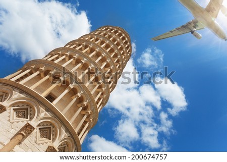 Low angle shot of Pisa tower and airplane with tourists passing by