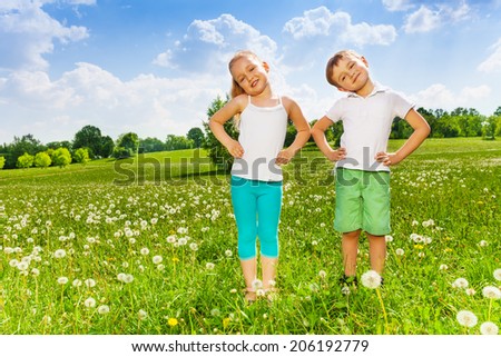 Two kids doing outdoor gymnastics