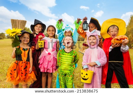 Happy excited kids in Halloween costumes