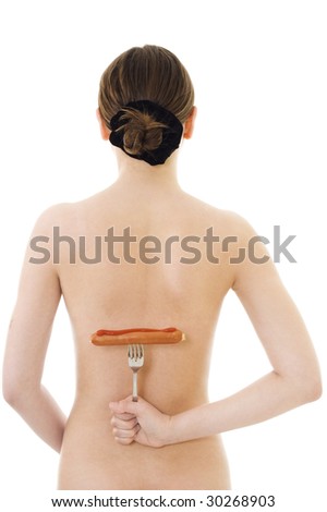 stock photo Young hot woman back vieiw holding sausage on fork