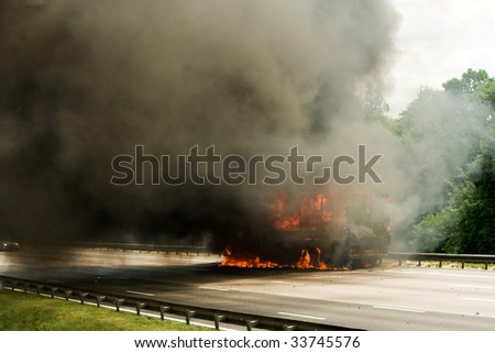 truck explosion on the road with a lot of fire and smoke