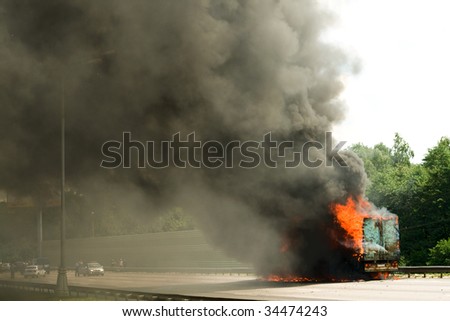 Road disaster - big long truck in fire