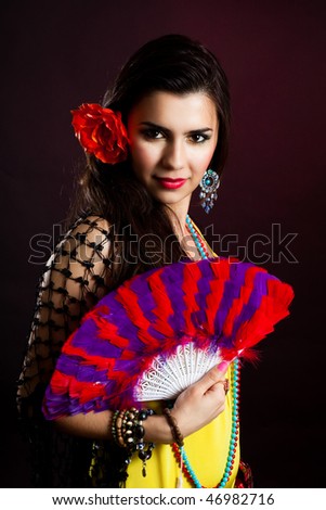 Beautiful gypsy woman with fan and attractive look