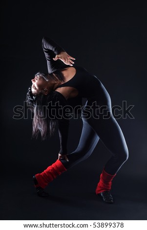 Woman expressing herself acting and posing on dark background