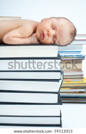 Little baby sleep on pile of books depicting education concept