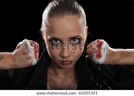 Strong determined angry woman face with fists