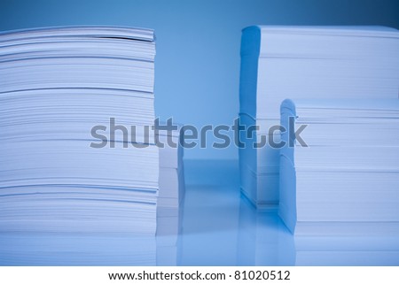 Many paper piles  on blue background