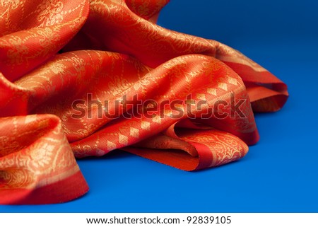 Close-up of Indian orange fabric beautifully folded