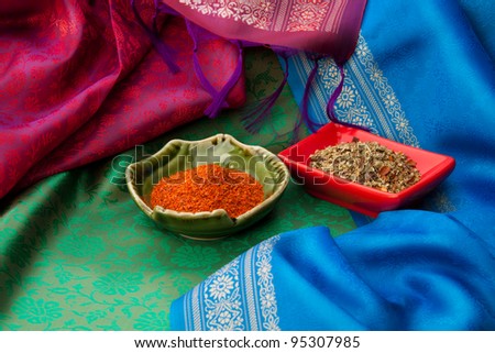 Indian spices with in the plates on the Indian traditional scarf\'s