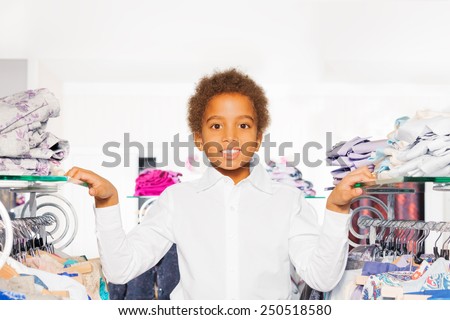 Close-up view of African boy in clothes store