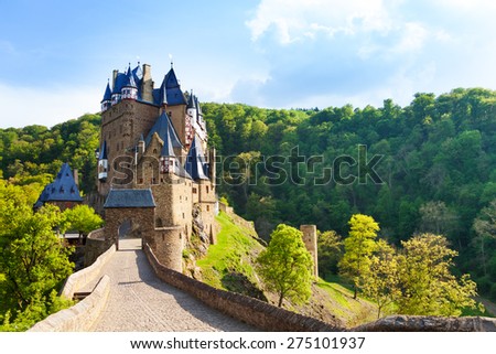 Road to the Eltz castle with towers, in hills