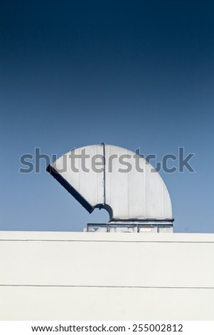 Industrial air conditioning and ventilation systems on a roof,on blue isolated.