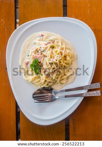 Spaghetti with cabonara sauce.\
Spaghetti with sauce.