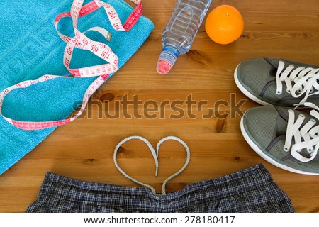 set for sports activities. shorts, sports water bottle, orange, headphones, sneakers.  Preparing for the summer, diet, healthy lifestyle