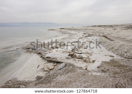 In the lowest point on Earth, the Dead Sea offers a unique landscape, where the salty blue waters overflow on its shores, designing natural amazing patterns and textures of mineral sediments.