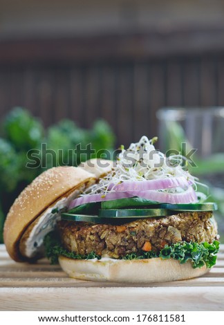 Vegetarian Lentils Burger with Cucumber, Alfalfa Sprout, Red Onions and a fresh mint yogurt dressing.