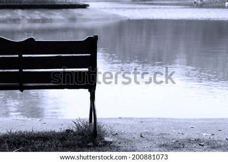 silhouette solitary bench at the lakeside