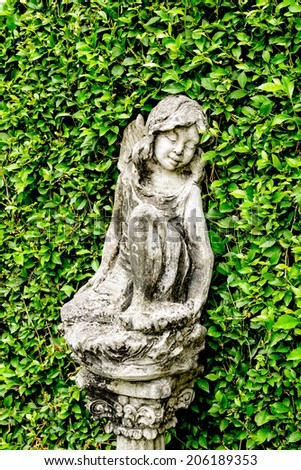 Classic image garden statues a little girl  in vintage style