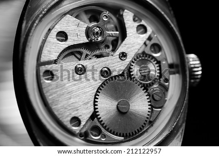 Mechanism inside an old watch. Black and white.
