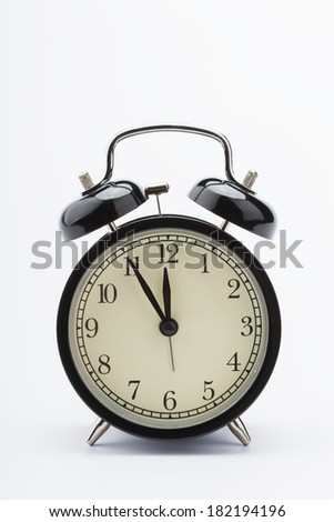 retro alarm clock, black on white background