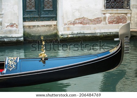 VENICE, ITALY - JUNE 26: Tourists travel on gondolas at canal on June 26, 2014 in Venice, Italy . Gondola trip is the most popular tourist activity in Venice.