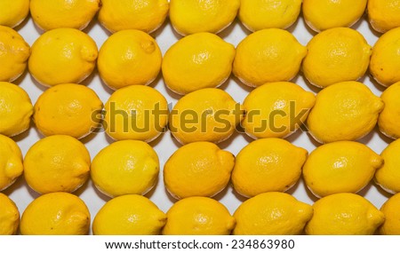 Ripe lemons, background on the shop counter