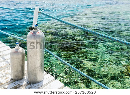 Oxygen cylinders for scuba diving on the background of the sea