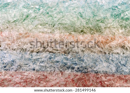Fragment of a surface covered with multiple layers of a cling polyethylene film as a background texture