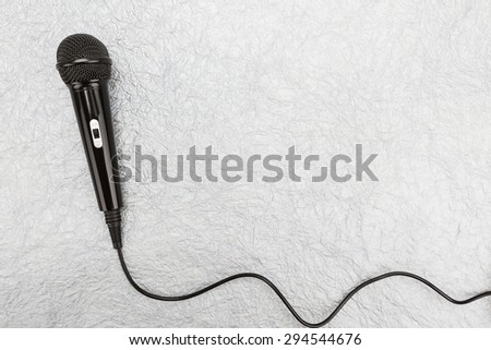 Microphone and cable on white background